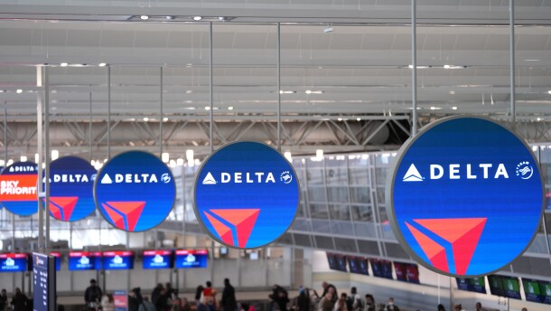 Delta Air Lines signs hang at Minneapolis-St. Paul Airport Monday, March 16, 2026, in Minneapolis. (AP Photo/Abbie Parr)