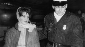 16 year old Priscilla Beaulieu is led away by a military policeman whilst trying to say goodbye to Elvis Presley at Frankfurt Airport, 2nd March 1960.