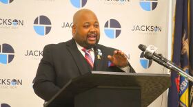 Jackson Mayor Daniel Mahoney speaking at a podium