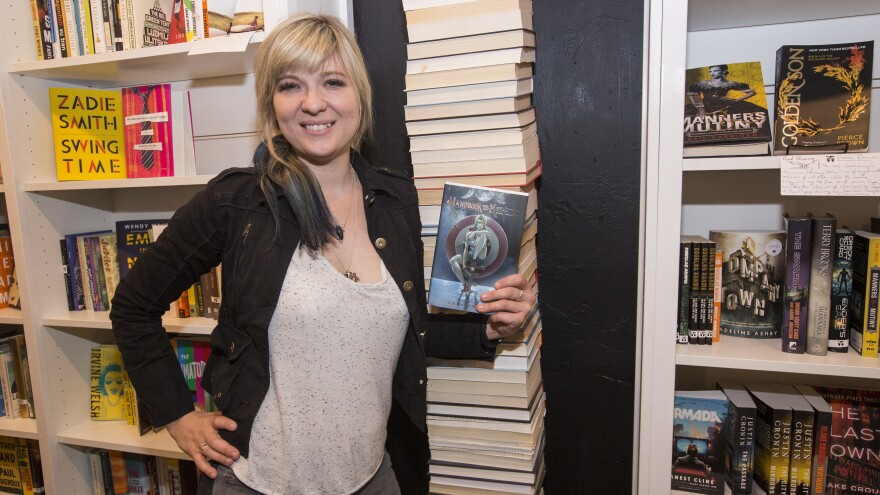 Lani Sarem poses with her novel <em>Handbook for Mortals</em> at the release party for the book in Chicago earlier this month.