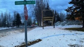 Gusty winds on Sunday, Jan. 12, 2025, tore apart the Alaska Mental Health Trust Authority sign in East Anchorage.