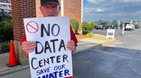 Charles Cross stands outside an open house about data centers in St. Charles, Missouri, on Aug. 13, 2026. Cross lives near the site of a proposed data center in St. Charles and does not want to see it built.