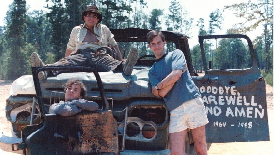 Chris Strompolos, Eric Zala and Jayson Lamb pose with their broken-down prop truck they used in their shot-for-shot remake of <em>Raiders of the Lost Ark.</em>