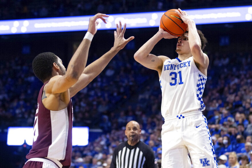 Kentucky guard Kellan Grady (31) shoots the ball over Mississippi State forward Garrison Brooks (10) during the first half of an NCAA college basketball game in Lexington, Ky., Tuesday, Jan. 25, 2022. (AP Photo/Michael Clubb)