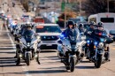 Hundreds of first responders line Chouteau Avenue as Ferguson Police Officer TJ Brown is transported to an out-of-state rehabilitation clinic on Tuesday, Nov. 12, 2024, in Midtown.