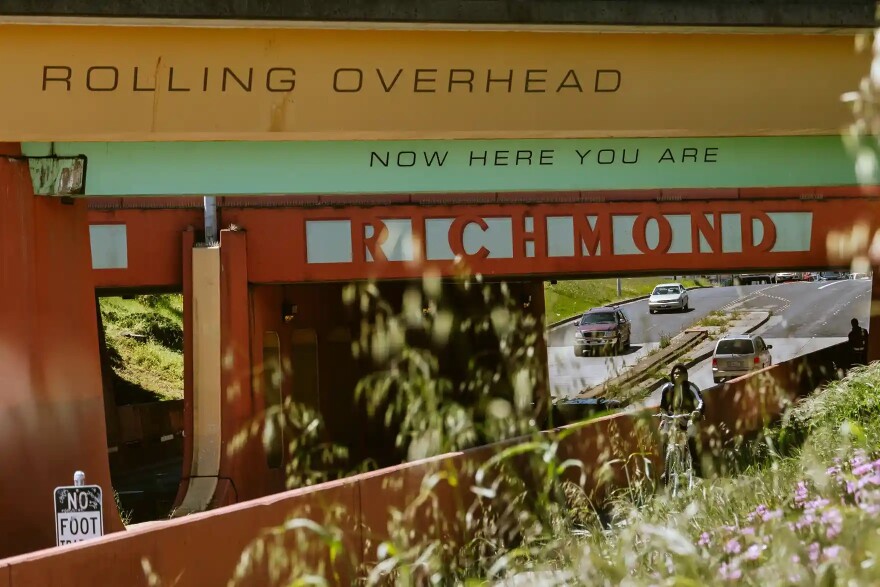 A cyclist on a bike path in Richmond. The city is known for programs fighting gun violence.