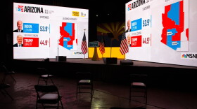 Election results from MSNBC are shown during Democratic Senate candidate Mark Kelly's Election Night event in Tucson, Arizona. Kelly ran against Republican Sen. Martha McSally for Arizona's Senate seat and is hoping to join fellow Democrat Sen. Kyrsten Sinema in the historically Republican state. (Courtney Pedroza/Getty Images)