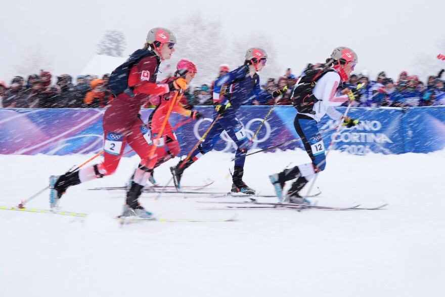 Norway's Idą Waldal, right, leads Switzerland's Marianne Fatton, left, and France's Emily Harrop, second from right, during a ski mountaineering women's sprint semifinal, at the 2026 Winter Olympics, in Bormio, Italy, Thursday, Feb. 19, 2026.