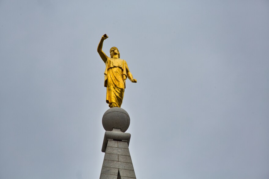 Photo of angel Moroni on top of the LDS Temple that shows the missing trumpet.