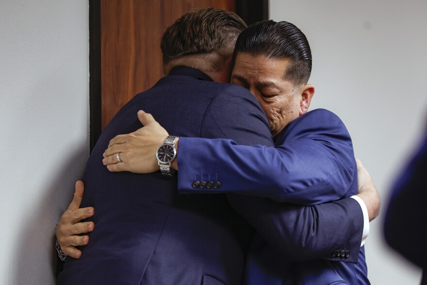 Former Uvalde school district police officer Adrian Gonzales, right, embraces his attorney Jason Goss after the jury found Gonzales not guilty at the Nueces County Courthouse on Wednesday, Jan. 21, 2026, in Corpus Christi, Texas.