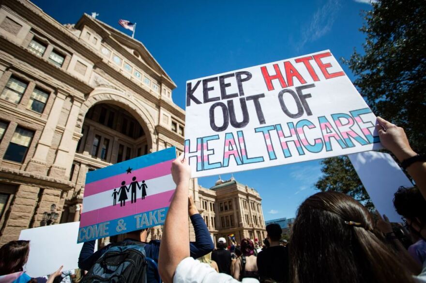 People gathered on the stairs across from the House floor to protest against Senate Bill 14, which seeks to ban puberty blockers and hormone therapies for transgender youth, before it is heard for debate in the House at the state Capitol in Austin on May 12.