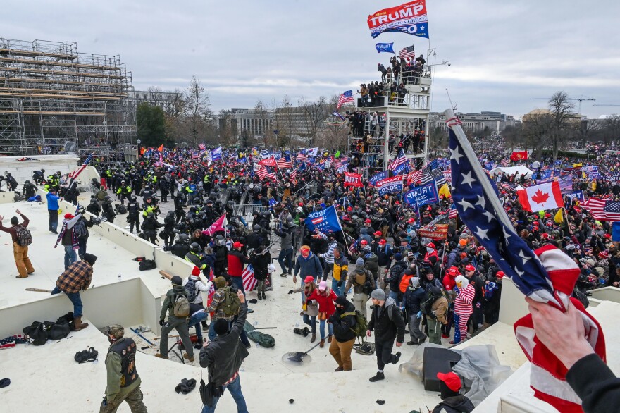 Pro-Trump extremists clash with police and security forces as they invade the inauguration platform.