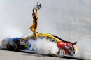 FILE - Kyle Busch celebrates his win in the NASCAR Sprint Cup Series' Autism Speaks 400 auto race, Sunday, May 16, 2010, in Dover, Del. (AP Photo/Nick Wass, File)