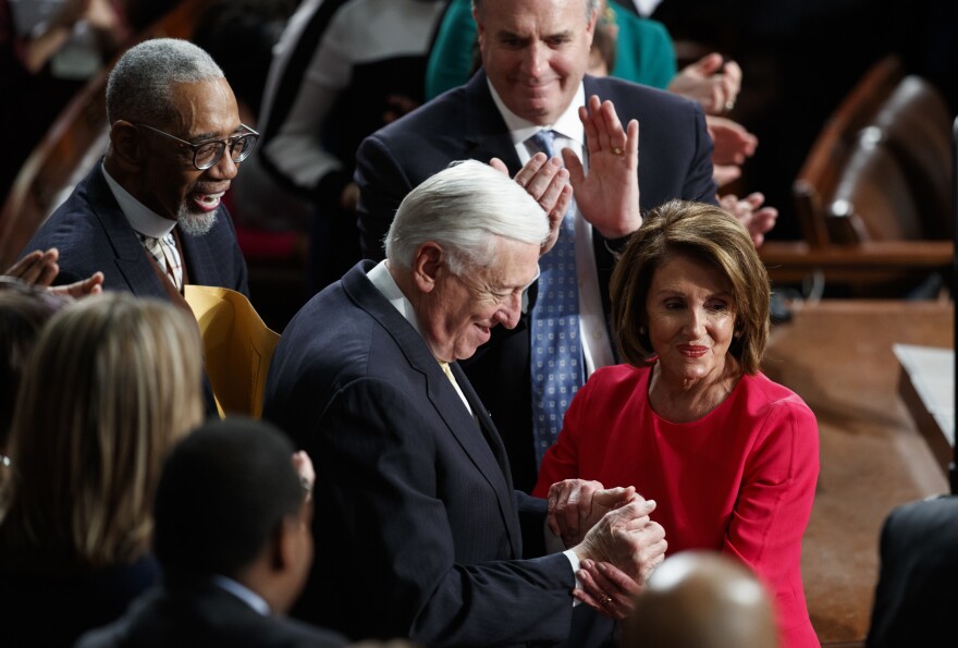 New Speaker of the House Nancy Pelosi, D-Calif., and House Majority Leader Steny Hoyer, D-Md., are applauded at the Capitol on Thursday as Democrats officially regain control of the chamber.