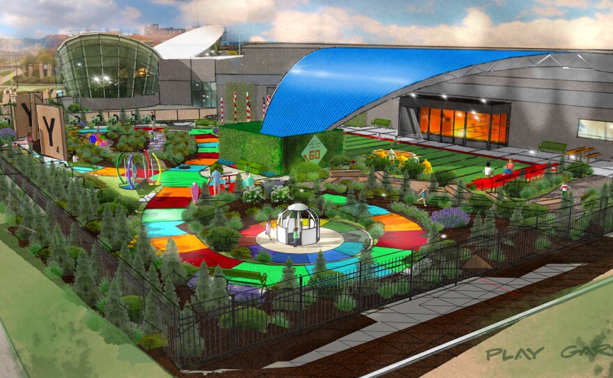 The Hasbro Game Park will be built on the south side of The Strong National Museum of Play, where the temporary entrance is today. A rendering shows the Candy Land-style pathway, a sports field and large, Scrabble-like play pieces spelling out "PLAY."