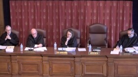 Indiana Supreme Court justices take turns asking questions from the bench at the hearing for the case on Sept. 15.