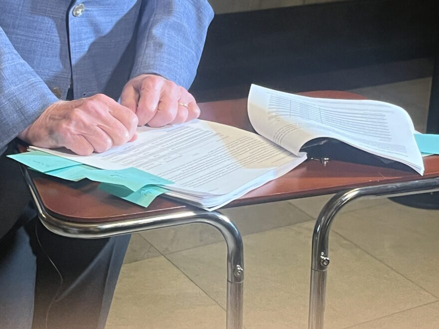 Rep. Ed DeLaney parses through a portion of the 127-page IEDC audit before reporters on Oct. 3, 2025.