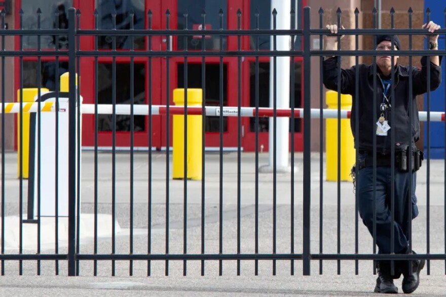 A security guard stands outside the Geo Group ICE detention center during a bond hearing for detained immigrant rights activist Jeanette Vizguerra-Ramirez, Friday, December 19, 2025, in Aurora. (Jeremy Sparig, Special to The Colorado Sun)