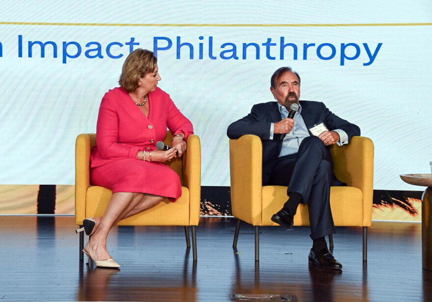 Jorge M. Perez, Chairman of the Related Group, and Jennifer O'Flannery Anderson, CEO of the Community Foundation of Broward, speak during a panel at the WLRN Sunshine Economy Summit in Fort Lauderdale on Sept. 23, 2026.