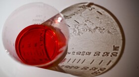 A 5ml dose of liquid oxycodone, an opioid pain relief medication, sits on a table in Washington, D.C., March 29, 2019. During the opioid epidemic, roughly 218,000 Americans have died from overdoses tied to prescription pain pills, according to the Centers for Disease Control and Prevention. EVA HAMBACH/AFP/Getty Images