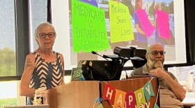 Sue Dinsdale, director of the Iowa Citizen Action Network, speaks Wednesday, July 29 at the Davenport Public Library Eastern Avenue branch, while Doug Sample of Davenport listens.