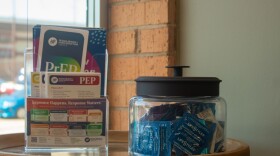 A jar of condoms and pamphlets for HIV prevention medication sits inside the waiting room of the New Hope Wellness Center, the clinical arm of Guiding Right. The public health nonprofit has received direct federal funding for decades, but now those dollars are being redirected to state health departments.