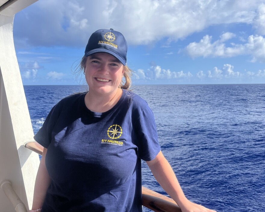 Jacqueline Ratliff stands aboard the Nautilus exploration vessel. It is capturing deep sea habitats in the Pacific.