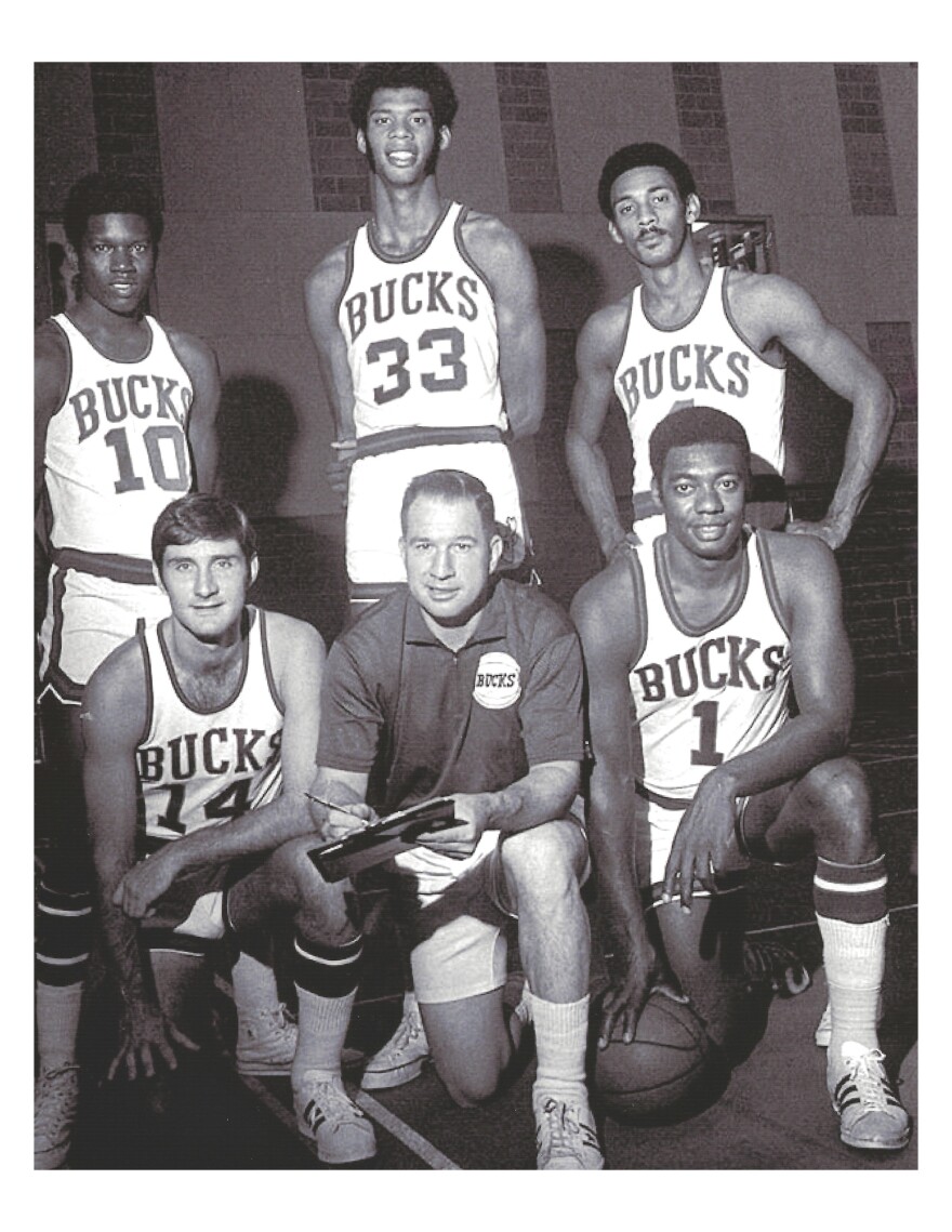 Players Oscar Robertson #1, Jon McGlocklin #14, Bob Dandridge #10, Greg Smith #4 and Kareem Abdul-Jabbar #33 with coach Larry Costello.