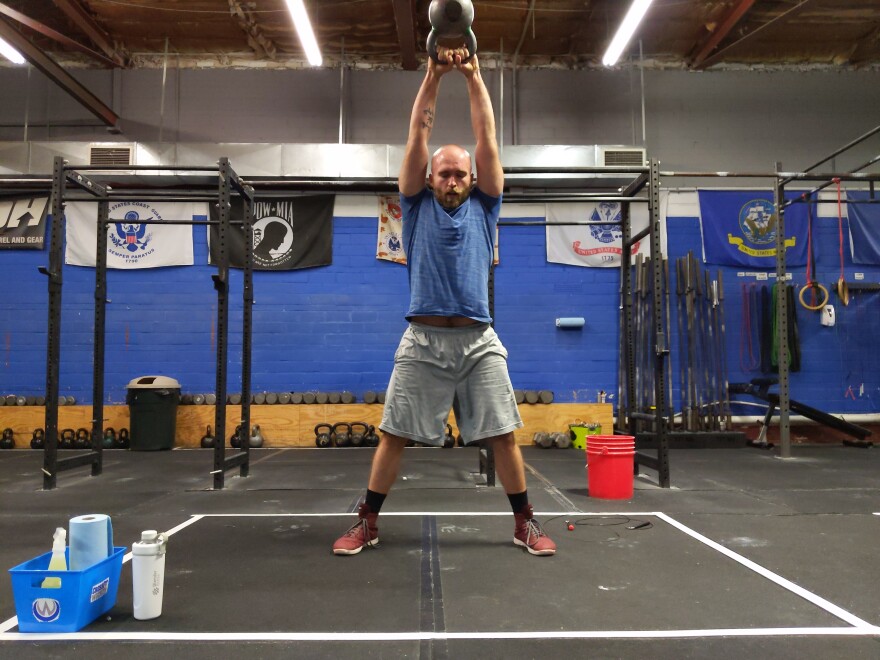 Tyler Swysgood performs kettlebell swings at Crossfit Wichita.