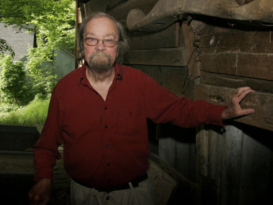 Donald Hall stands in the barn of the 200-year-old Wilmot farm that has been in his family for four generations. His latest poetry collection is called <em>The Back Chamber.</em>