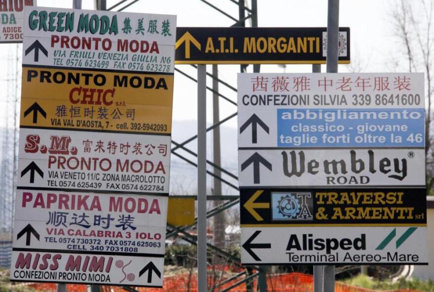 Street signs cater to the languages spoken in Prato.