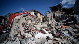 Rescuers and firemen inspect the rubble of buildings in Amatrice, Italy on Aug. 24, 2016. (Filippo Monteforte/AFP/Getty Images)