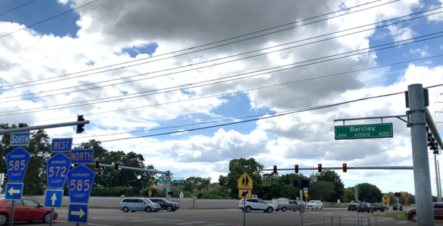 road signs next to an intersection