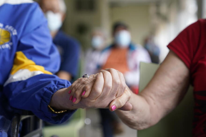 Ten percent of all Americans are caregivers for a parent aged 65 or older. (Lynne Sladky/AP)