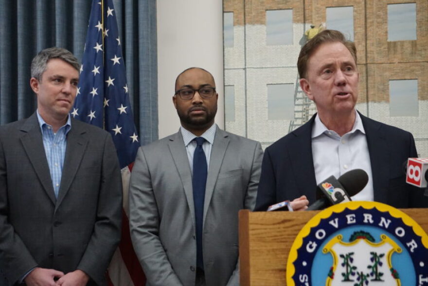 Gov. Ned Lamont introducing Paul Mounds, center, as chief of staff, and Josh Geballe, left, as chief operating officer on Feb. 27, 2020.