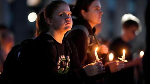 Community members gather during a candlelight vigil for Sgt. Declan Coady, 20, of West Des Moines, Iowa, who died when a drone hit a command center in Port Shuaiba, Kuwait, during the Iran Israel U.S. war, Monday, March 9, 2026, at Drake University in Des Moines, Iowa. (Charlie Neibergall/AP)