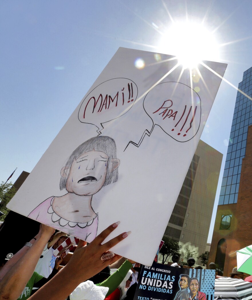 People protest immigration separation policies outside Federal Court on Tuesday in El Paso, Texas. Cases of children and families seeking refuge were being heard inside the courthouse.