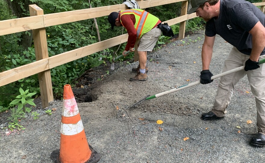 Volunteers fix holes on the D&H Rail Trail.