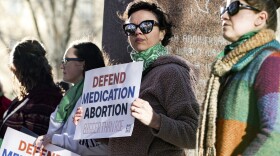 Lindsay London holds a protest sign in front of a federal court building in support of access to abortion medication outside the Federal Courthouse on Wednesday, March 15, 2023 in Amarillo, Texas. Last August, the 5th U.S. Circuit Court of Appeals issued a ruling that would limit access to mifepristone, approved by the Food and Drug Administration in 2000 for the medical termination of pregnancy. The matter is slated to come before the U.S. Supreme Court on March 26, 2024.