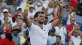 Grigor Dimitrov of Bulgaria celebrates after defeating Nick Kyrgios of Australia in the men's singles final at the Western & Southern Open on Aug. 20, 2017, in Mason. Dimitrov won 6-3, 7-5. 
