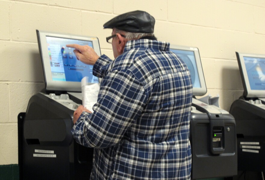 A gambler places a bet on a horse race at Freehold Raceway, Friday, Dec. 14, 2018, in Freehold, N.J. The track says it wants to offer sports betting next year. It would become the third horse racing track in New Jersey to do so.