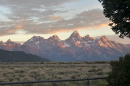 Mountains rise behind the plains.