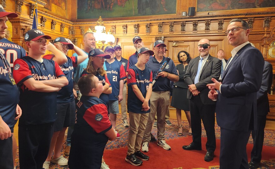 Gov. Josh Shapiro speaks to members of the Wyoming Valley Challenger baseball team.