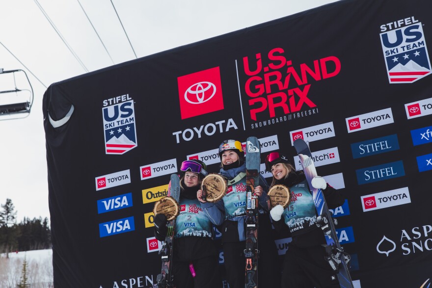 Rell Harwood stands on the podium at the U.S Grand Prix in Aspen, Colorado after the slopestyle finals.