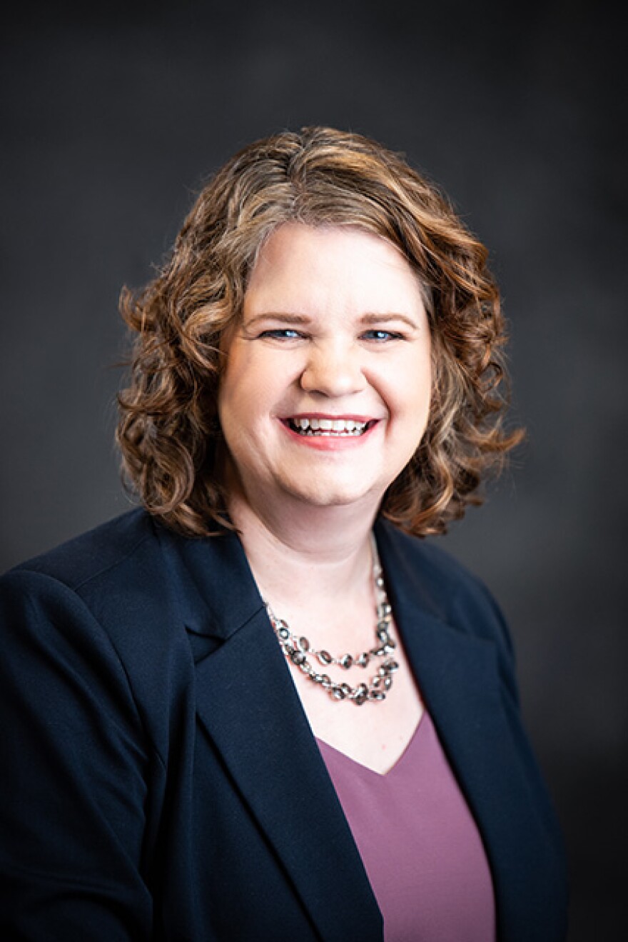 Kristen Davis-Coelho smiles and poses for a headshot photo.