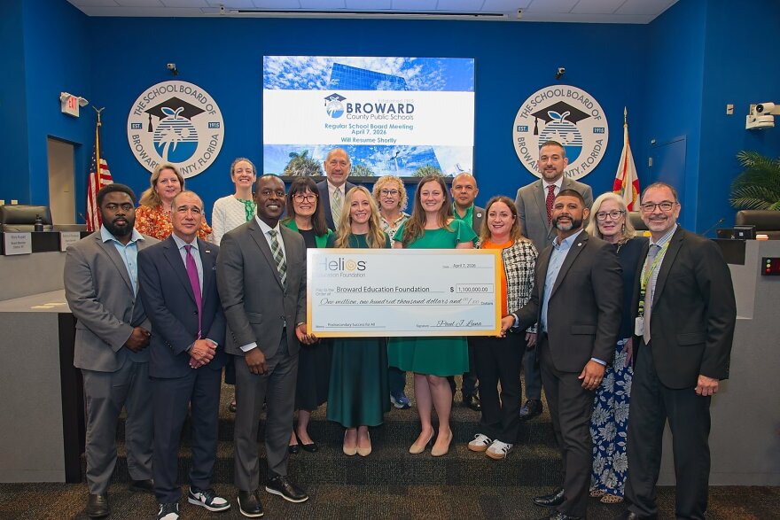 Broward County Public Schools board members and administrators, along with Broward Education Foundation and Bridge2Life, accept a $1.1 million 'Post Secondary Success for All' grant from Helios Education Foundation.