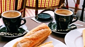 Baguettes and coffee outside cafe