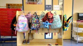 Student backpacks hang in their cubbies at a school in Alaska. At least 30 states have opted into a federal program allowing individuals to receive tax credits for donations to scholarship organizations that might offer tuition help for private schools or extra tutoring.