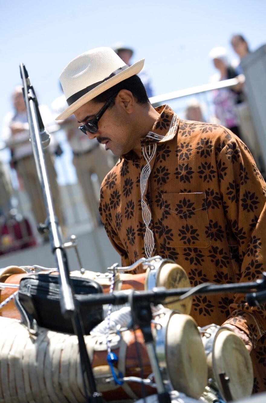 Percussionist and bandleader John Santos performs with Afro Cuban <em>batá</em> drums in California's Bay Area.