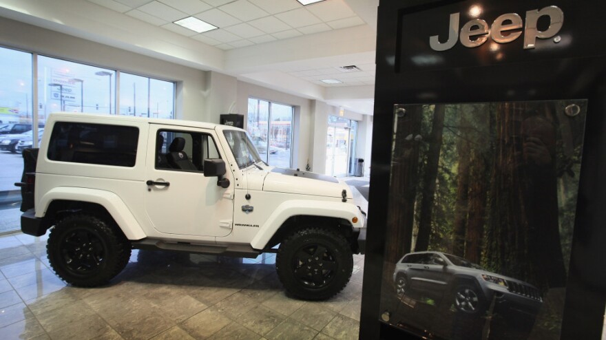 A Jeep Wrangler is seen at a dealership in Chicago. Powered by a newly designed fleet of vehicles, the brand saw a sharp rise in sales in 2011.